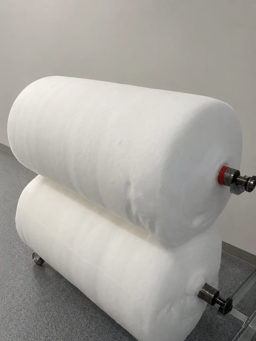 Two large rolls of carded cotton sheet at the WJ Cotton factory