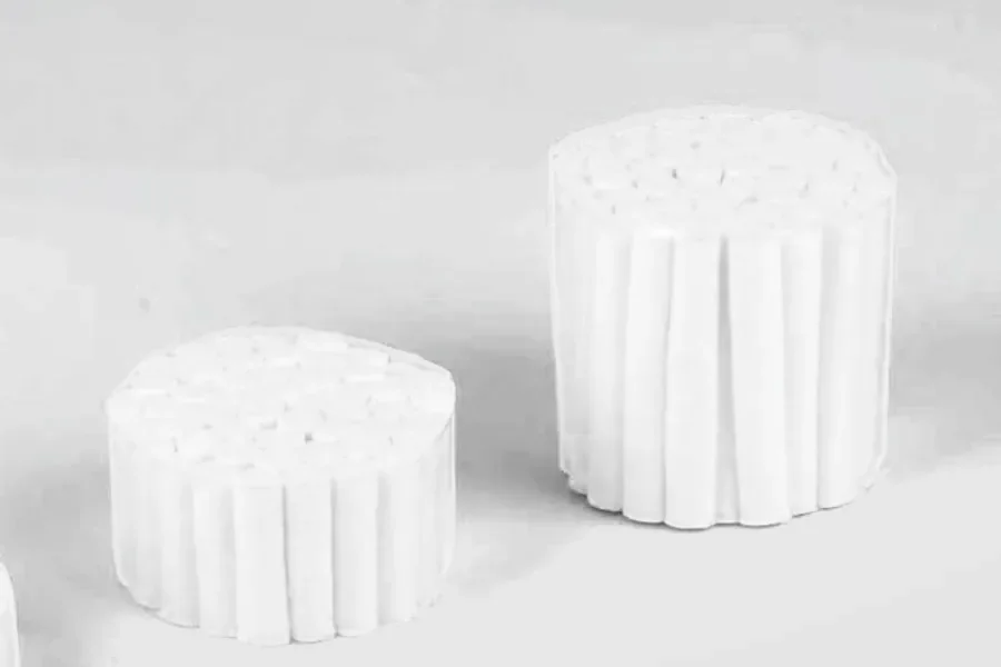 Two bundles of dental cotton rolls: standard length and a longer roll