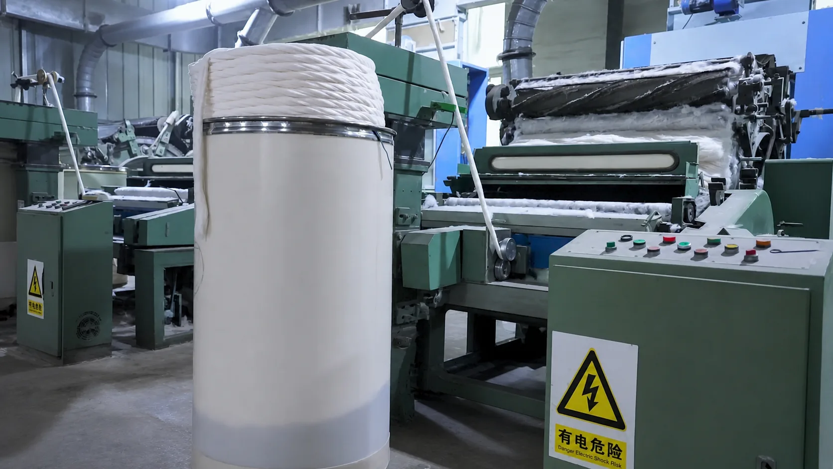 Carding machine preparing bleached absorbent cotton for downstream forming