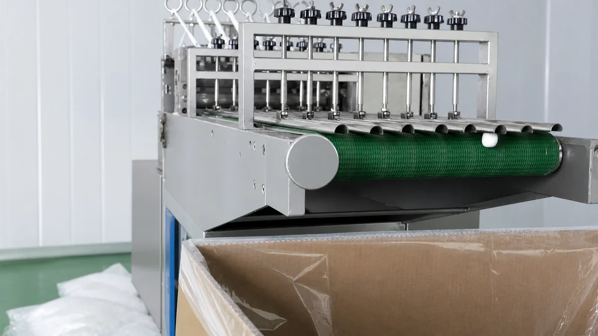 Cotton ball forming machine in production